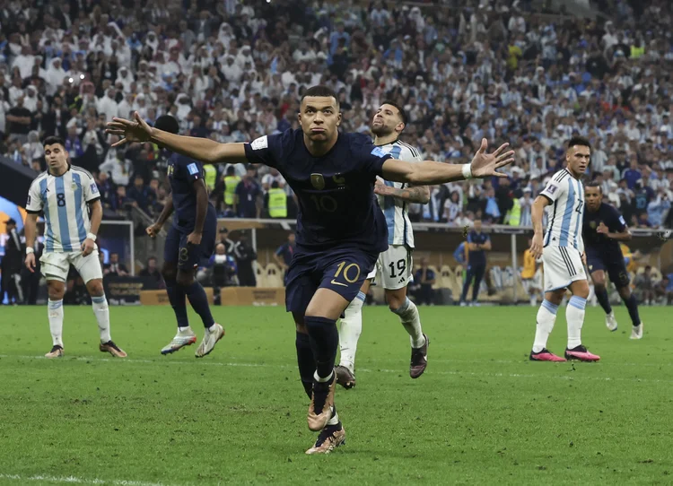 LUSAIL CITY, QATAR - DECEMBER 18: Kylian Mbappé of France celebrates after scoring to make it 3-3 during the FIFA World Cup Qatar 2022 Final match between Argentina and France at Lusail Stadium on December 18, 2022 in Lusail City, Qatar. (Photo by Ian MacNicol/Getty Images) (Ian MacNicol/Getty Images)