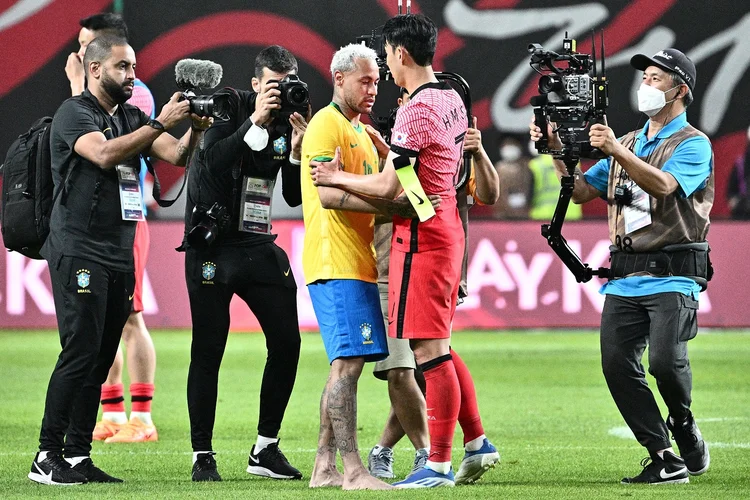 Brazil's forward Neymar (centre L) and South Korean forward Son Heung-min (centre R) hug after full time at Seoul World Cup Stadium in Seoul on June 2, 2022, after a friendly football match between South Korea and Brazil. (Photo by ANTHONY WALLACE / AFP) (Photo by ANTHONY WALLACE/AFP via Getty Images) (ANTHONY WALLACE/AFP/Getty Images)