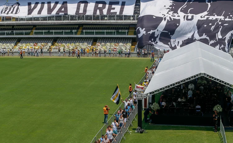 Fans of late Brazilian football legend Pele gather inside the Urbano Caldeira stadium to attend his wake in Santos, Sao Paulo, Brazil on January 2, 2023. - Brazilians bid a final farewell this week to football giant Pele, starting Monday with a 24-hour public wake at the stadium of his long-time team, Santos. (Photo by Miguel SCHINCARIOL / AFP) (Photo by MIGUEL SCHINCARIOL/AFP via Getty Images) (MIGUEL SCHINCARIOL/Getty Images)