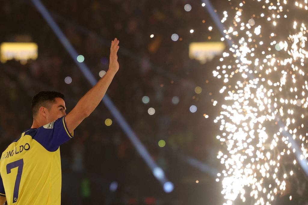 Al-Nassr's new Portuguese forward Cristiano Ronaldo greets the fans during his unveiling at the Mrsool Park Stadium in the Saudi capital Riyadh on January 3, 2023. (Photo by Fayez Nureldine / AFP) (Photo by FAYEZ NURELDINE/AFP via Getty Images) (FAYEZ NURELDINE/Getty Images)