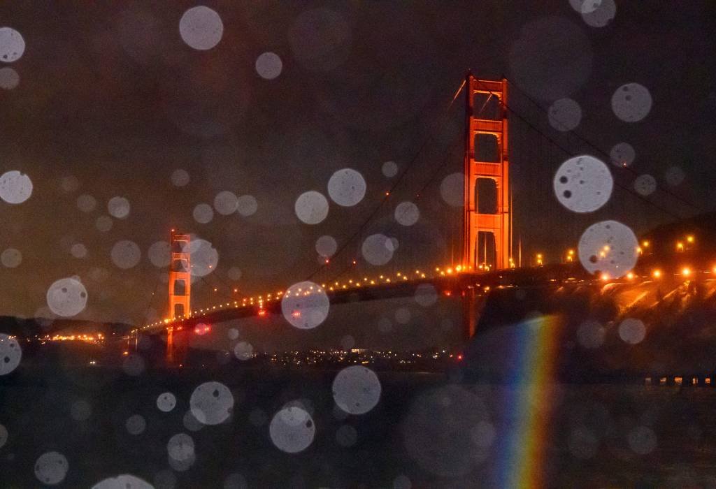 The Golden Gate Bridge is seen through a mix of rain and splashing bay water in Sausalito, California on January 5, 2023. - Damaging winds, excessive rainfall and extremely heavy snow are expected to wallop California and southern Oregon through January 5 as a series of winter storms rip across the western US coast, prompting the Golden State's governor to declare an emergency. (Photo by JOSH EDELSON / AFP) (Photo by JOSH EDELSON/AFP via Getty Images) (JOSH EDELSON/Getty Images)