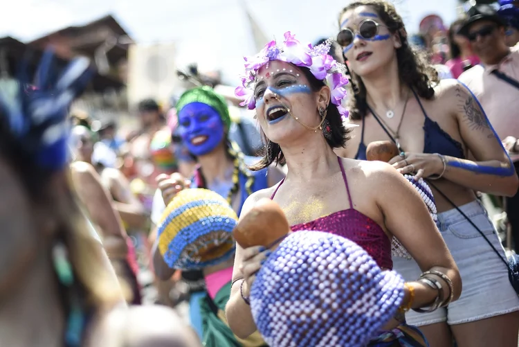 Members of the "Pena de Pavao de Krishna" traditional carnival group which celebrates Indian deities, perform in Belo Horizonte, Brazil, on March 3, 2019. (Photo by DOUGLAS MAGNO / AFP)        (Photo credit should read DOUGLAS MAGNO/AFP via Getty Images) (DOUGLAS MAGNO/AFP/Getty Images)