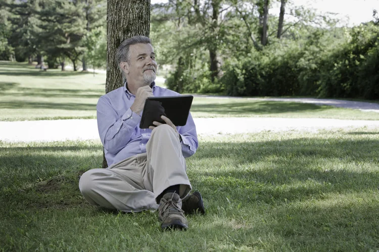 Senior man using tablet-like device (Getty Images/Getty Images)