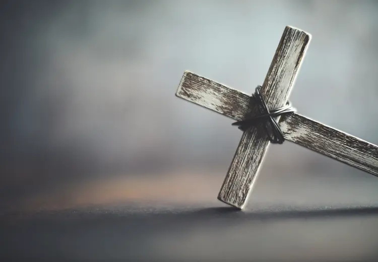 Cross in rustic setting. Religious background with copy space (Stock/Getty Images)