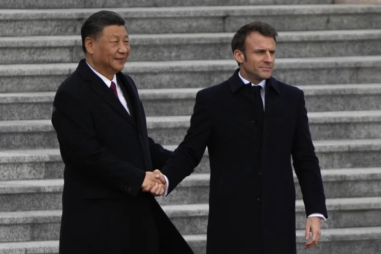 BEIJING, CHINA - APRIL 06: French President Emmanuel Macron shakes hands with Chinese President Xi Jinping during a welcome ceremony outside the Great Hall of the People on April 6, 2023 in Beijing, China. French President Macron is in China for a three-day state visit, seeking to change Chinese President Xi's stance on the Russia-Ukraine war, and improving European trade ties. (Photo by Ng Han Guan - Pool/Getty Images) (Ng Han Guan/Getty Images)