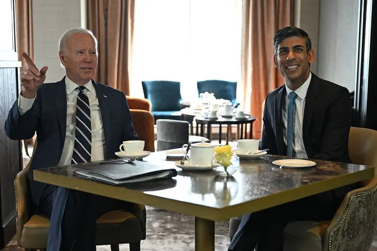 US President Joe Biden (L) reacts as he meets with Britain's Prime Minister Rishi Sunak in Belfast on April 12, 2023, as part of a four day trip to Northern Ireland and Ireland for the 25th anniversary commemorations of the "Good Friday Agreement". (Photo by Jim WATSON / AFP) (Photo by JIM WATSON/AFP via Getty Images) (JIM WATSON/Getty Images)