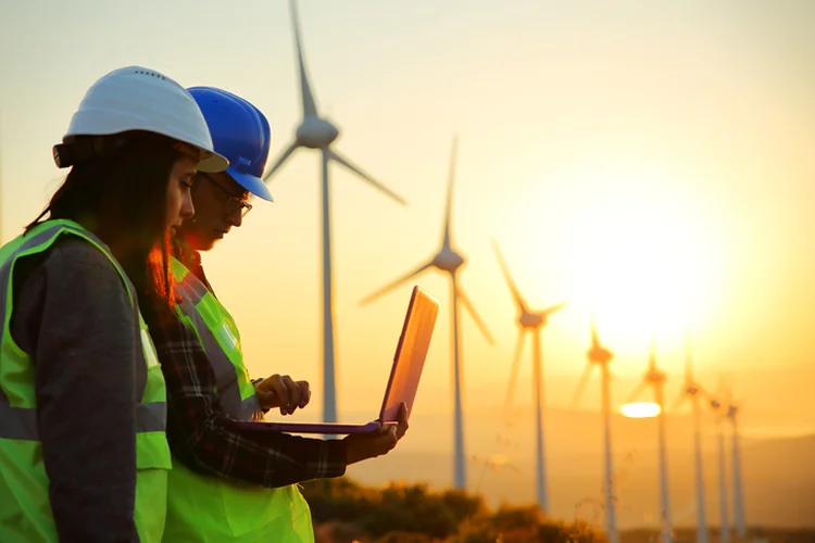 Windmills and Workers (aydinmutlu/Getty Images)