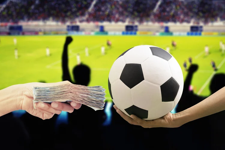 football and money ,game (iStock/Getty Images)