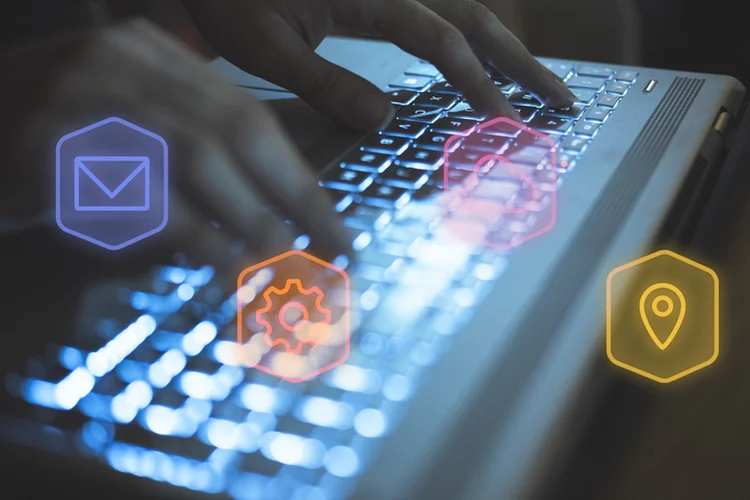 Close-up photograph of a woman's hands working with her laptop (Getty/Getty Images)