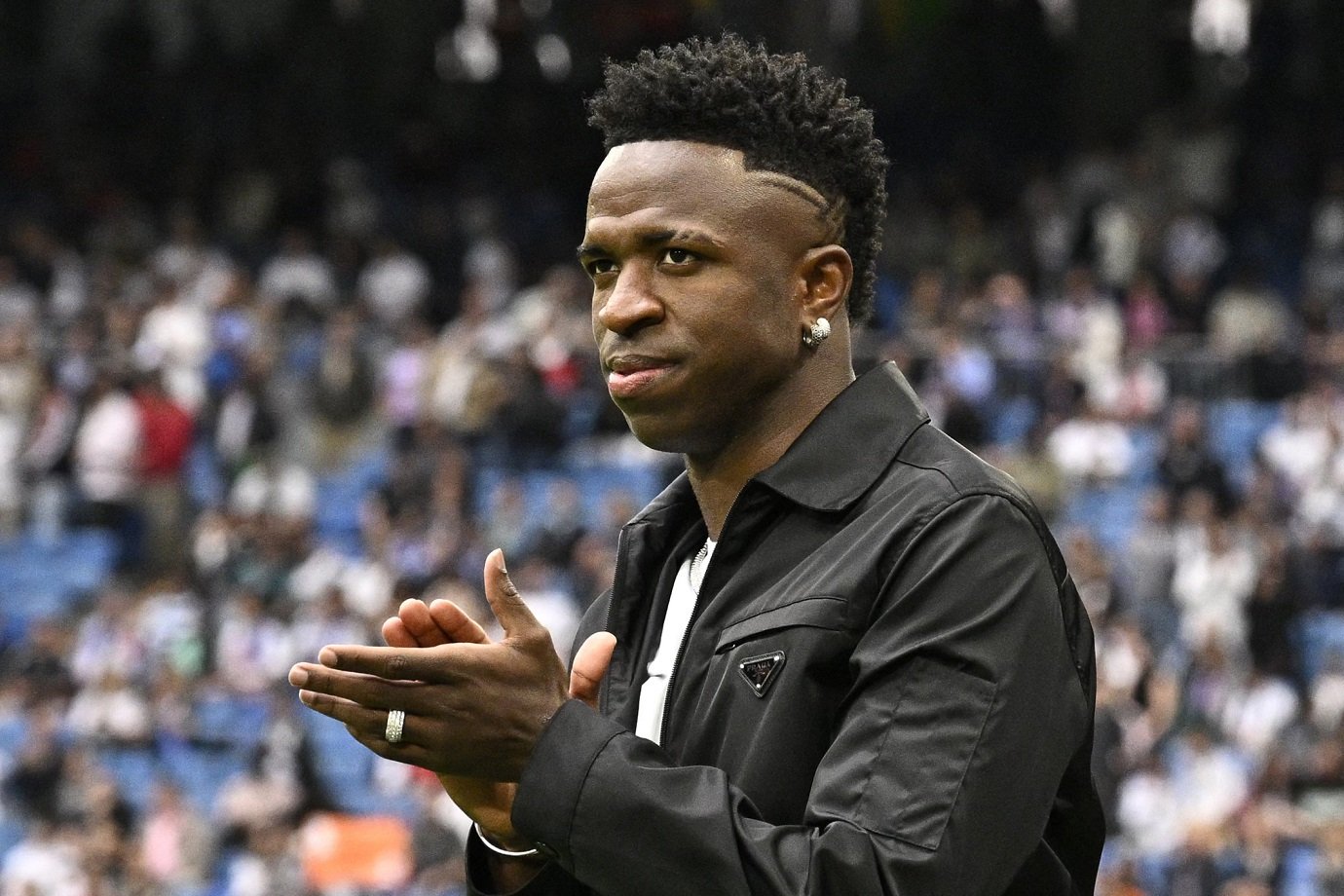 Real Madrid's Brazilian forward Vinicius Junior greets the audience prior the Spanish league football match between Real Madrid CF and Rayo Vallecano de Madrid at the Santiago Bernabeu stadium in Madrid on May 24, 2023. Vinicius drew global support after making a stand against racist abuse he received on May 21 from Valencia supporters at their Mestalla stadium. (Photo by JAVIER SORIANO / AFP) (Photo by JAVIER SORIANO/AFP via Getty Images)