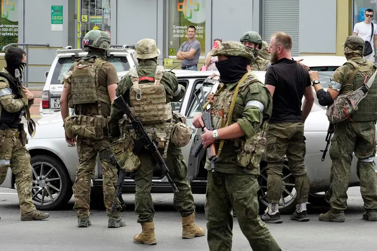 Members of Wagner group inspect a car in a street of Rostov-on-Don, on June 24, 2023. President Vladimir Putin on June 24, 2023 said an armed mutiny by Wagner mercenaries was a "stab in the back" and that the group's chief Yevgeny Prigozhin had betrayed Russia, as he vowed to punish the dissidents. Prigozhin said his fighters control key military sites in the southern city of Rostov-on-Don. (Photo by STRINGER / AFP) (Photo by STRINGER/AFP via Getty Images) (STRINGER/AFP/Getty Images)