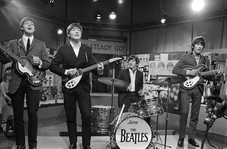 The Beatles at Television House, Kingsway, for an appearance on the television Show "Ready, Steady, Go" Left to right: Paul McCartney, John Lennon, Ringo Starr and George Harrison pictured playing on stage. 20 March 1964 (Photo by Unknown/Mirrorpix/Mirrorpix via Getty Images) (Mirrorpix/elevision House, Kingsway/Getty Images)