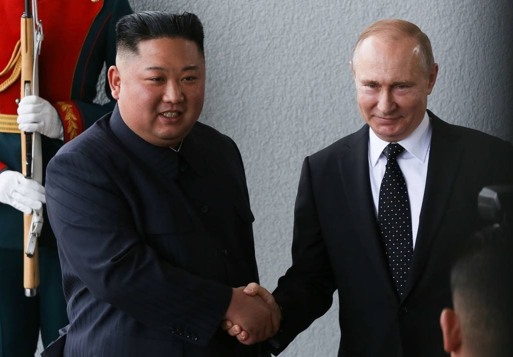 Kim Jong Un, North Korea's leader, left, shakes hands with Vladimir Putin, Russia's president, ahead of the summit on Russky Island near Vladivostok, Russia, on Thursday, April 25, 2019. Kim huddled with Putin in their first summit Thursday, as the North Korean leader sought diplomatic support to help him find a way out of his stalemate in nuclear talks with Donald Trump. Photographer: Andrey Rudakov/Bloomberg via Getty Images (Andrey Rudakov/Getty Images)