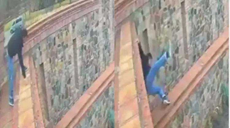 Um vídeo divulgado na segunda-feira, 28, que gravou o momento da queda, mostra o homem descendo do terraço em direção a um muro (Internet/Reprodução)