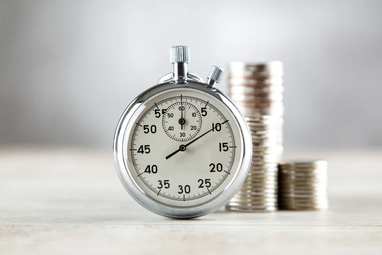 Analog stopwatch closeup on grey background