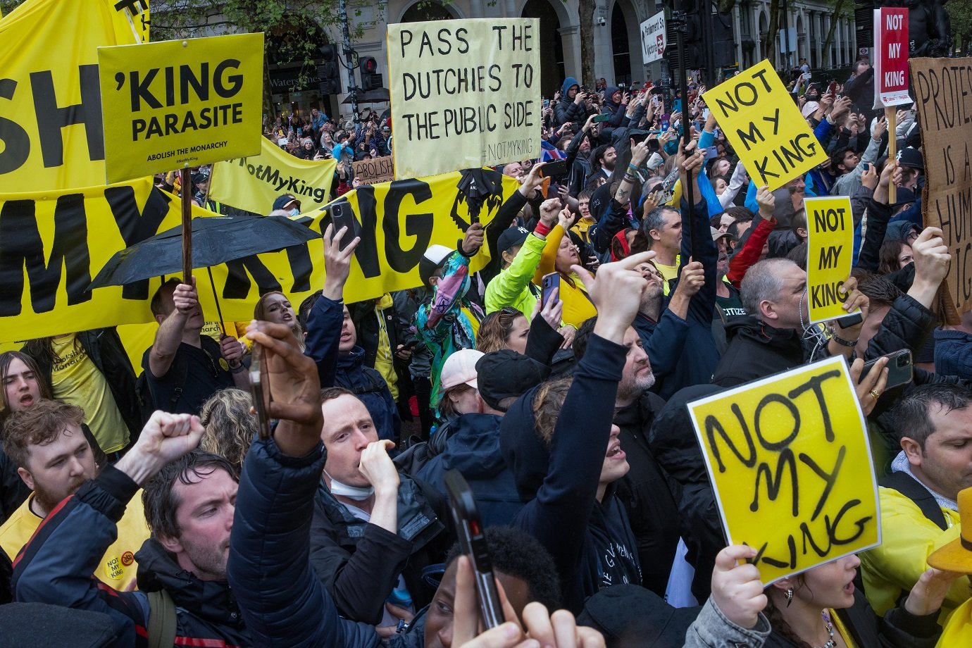 Campaigners from anti-monarchy movement Republic protest holding signs and banners as the Coronation Procession of King Charles III and Queen Camilla passes through Trafalgar Square on 6 May 2023 in London, United Kingdom. Republic campaigns for the monarchy to be replaced by a democratically elected constitutional Head of State. (photo by Mark Kerrison/In Pictures via Getty Images)