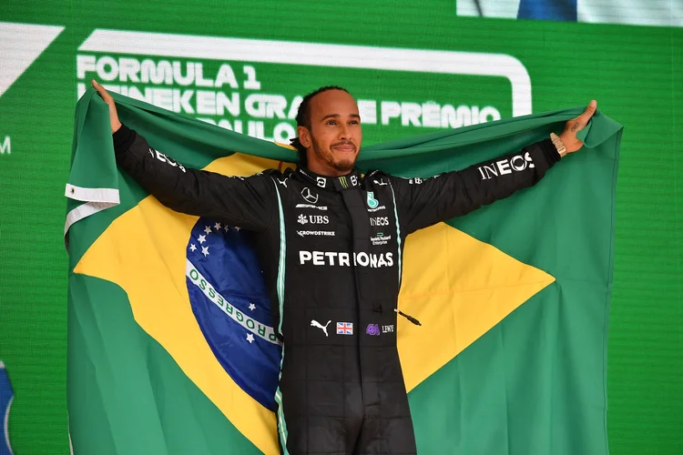 Mercedes' British driver Lewis Hamilton celebrates on the podium after winning Brazil's Formula One Sao Paulo Grand Prix at the Autodromo Jose Carlos Pace, or Interlagos racetrack, in Sao Paulo, on November 14, 2021. (Photo by NELSON ALMEIDA / AFP) (Photo by NELSON ALMEIDA/AFP via Getty Images) (NELSON ALMEIDA/Getty Images)