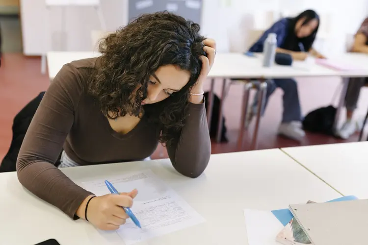 A high school student is having a hard time while focusing on a test during class. (Getty Images/Getty Images)