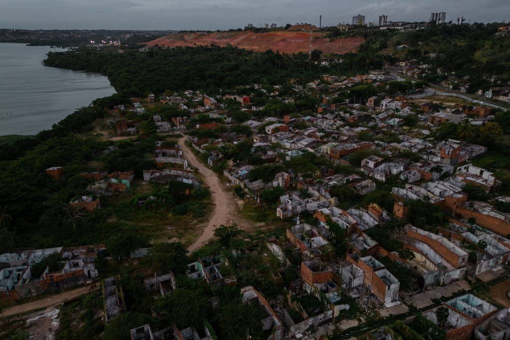 Braskem's operating area behind a destroyed neighborhood that was evacuated due to the risk of the ground sinking in Maceio, Alagoas state, Brazil, on Monday, Dec. 4, 2023. Brazilian petrochemical company Braskem was hit with a 1 billion reais ($205 million) civil action lawsuit over potential damages from a likely collapse of a rock-salt mines operated by the company. The city of Maceió declared a state of emergency for 180 days, as it works to evacuate thousands of people from an emerging sinkhole. Photographer: Maira Erlich/Bloomberg via Getty Images (Bloomberg/Getty Images)