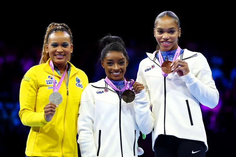 ANTWERP, BELGIUM - OCTOBER 06: (L-R) Silver medalist Rebeca Andrade of Team Brazil, gold medalist Simone Biles of Team United States and bronze medalist Shilese Jones of Team United States pose for a photo during the medal ceremony for the medal ceremony for the Women's All Around Final on Day Seven of the 2023 Artistic Gymnastics World Championships at Antwerp Sportpaleis on October 06, 2023 in Antwerp, Belgium. (Photo by Naomi Baker/Getty Images) (Getty Images Europe/Getty Images)