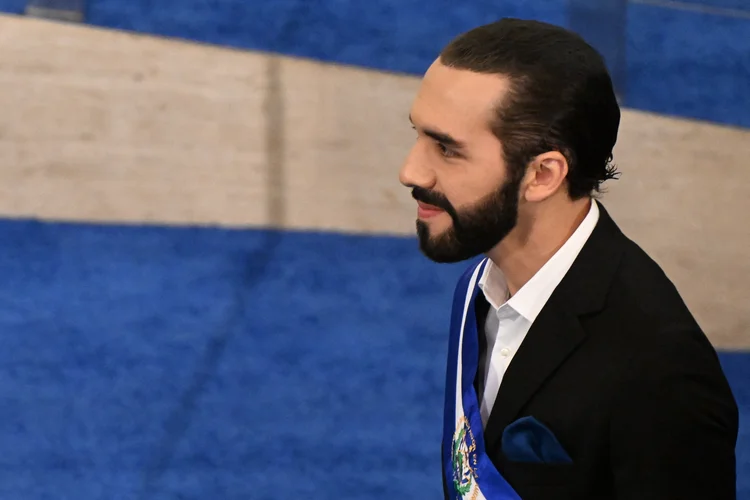 (FILES) Salvadoran President Nayib Bukele delivers his annual address to the nation marking his fourth year in office at the San Salvador Legislative Assembly on June 1, 2023. El Salvador's gang-busting President Nayib Bukele has proudly embraced the monicker of "dictator" and breezily shrugs off criticism of human rights transgressions. In five years in power, the 42-year-old millennial businessman and former mayor has become globally known, and domestically loved, for his no-holds-barred "war" on drug gangs. (Photo by MARVIN RECINOS / AFP) (MARVIN RECINOS/AFP)