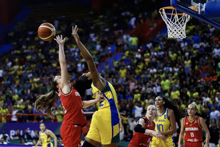 Brazil's Damiris Dantas (R) and Germany's Alexandra Wilke jump for the ball during the Pre-olympic Tournament match between Brazil and Germany at the Arena Guilherme Paraense in Belem, Para state, Brazil on February 11, 2024. (Photo by Thiago Gomes / AFP) (Photo by THIAGO GOMES/AFP via Getty Images) (THIAGO GOMES/Getty Images)