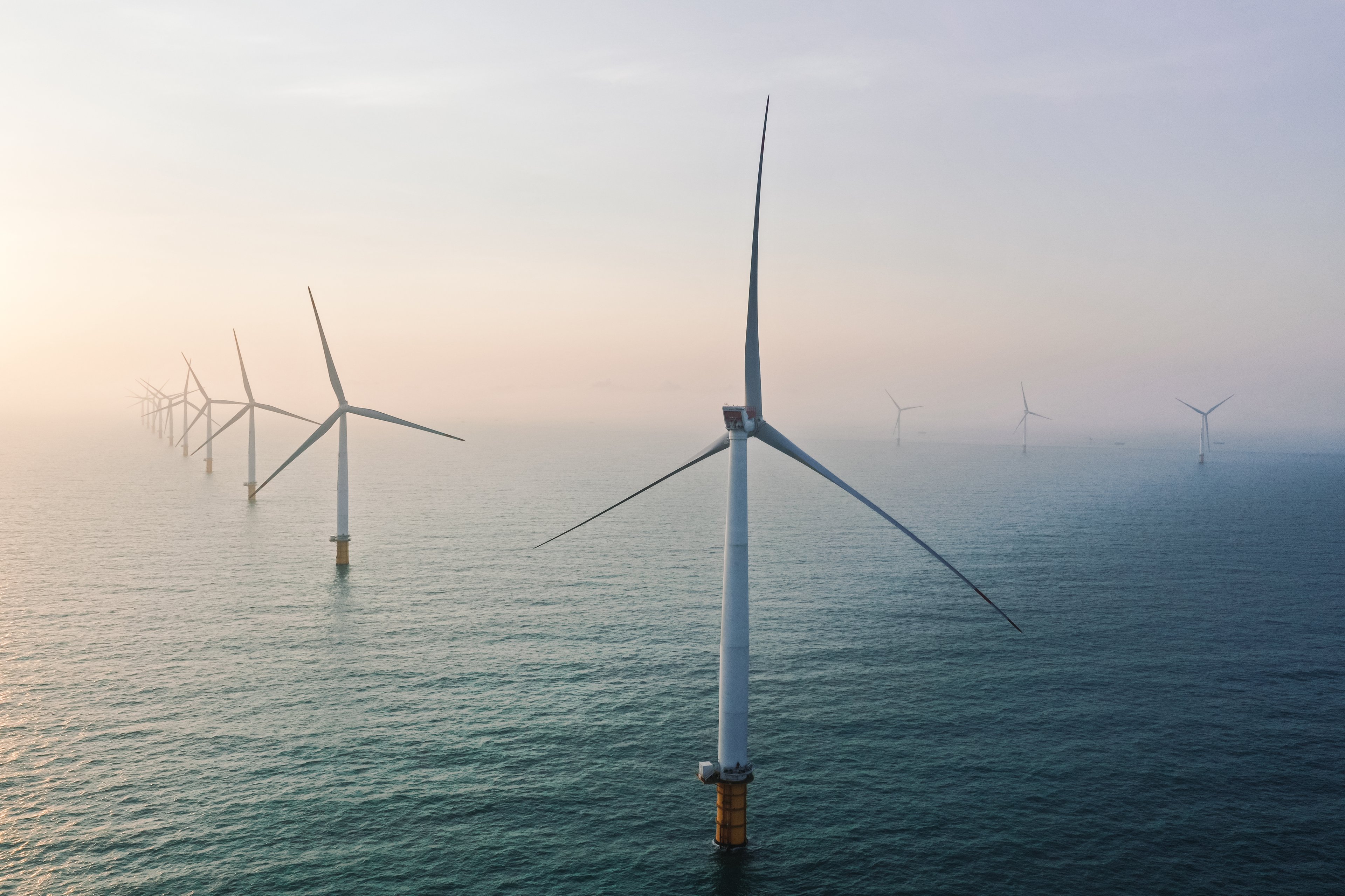 Row of winturbines in the sea