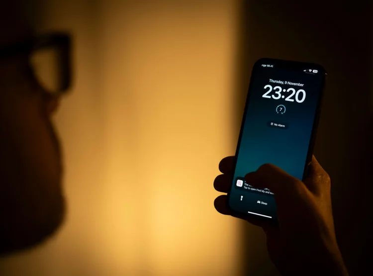 The time is seen displayed on the lock screen of an Apple iPhone in this photo illustration taken on 10 November, 2023 in Warsaw, Poland. (Photo by Jaap Arriens/NurPhoto via Getty Images) (Jaap Arriens/NurPhoto/Getty Images)