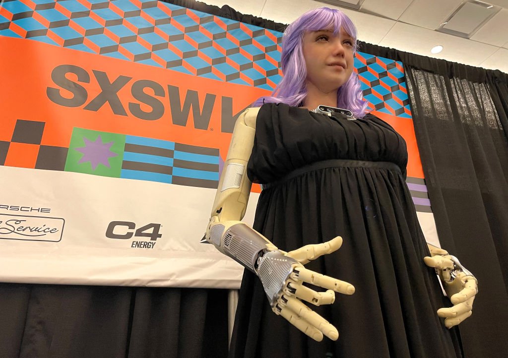 Desdemona, a humanoid robot designed by Hanson Robotics and endowed with expressiveness and interactivity to teach AI to understand and care about people, is displayed at a SXSW conference titled "How to make AGI beneficial and avoid a robot apocalypse" in Austin, Texas, on March 12, 2024. David Hanson - founder of Hanson Robotics and who designed Desdemona, a humanoid robot that functions with generative AI - brainstromed about the plus and minuses of AI with superpowers.
AI's "positive disruptions can help to solve global sustainability issues, although people are probably going to be just creating financial trading algorithms that are absolutely effective," he said.
Hanson fears the turbulence from AI, but pointed out that humans are doing a "fine job" already of playing "existential roulette" with nuclear weapons and by causing "the fastest mass extinction event in human history." (Photo by SUZANNE CORDEIRO / AFP) (Photo by SUZANNE CORDEIRO/AFP via Getty Images)
