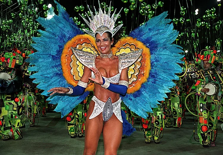 RIO DE JANEIRO, BRAZIL:  Luiza Brunet, the Queens of Drums of the Imperio Serrano Samba School, marches through the Sambodrome in Rio de Janeiro 23 February during annual Carnival celebrations. The theme of the Imperio Serrano School, which features some 4,000 dancers, is "Man and the Future."     AFP  PHOTO Antonio SCORZA (Photo credit should read ANTONIO SCORZA/AFP via Getty Images) (ANTONIO SCORZA/AFP/Getty Images)