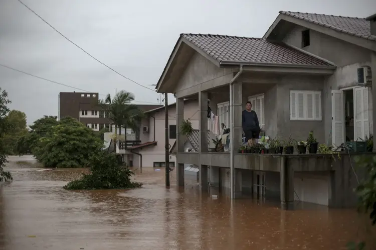 Jefferson Abreu Teles, resident of Quilombo neighborhood, rests after choosing to stay at his flooded house in Sao Sebastiao do Cai, Rio Grande do Sul state, Brazil on May 2, 2024. The death toll from a severe storm in Rio Grande do Sul, in southern Brazil, rose to 13, amid the "worst disaster" in the history of the state where President Luiz Inacio Lula da Silva traveled on Thursday. (Photo by Anselmo Cunha / AFP) (Anselmo Cunha/AFP)