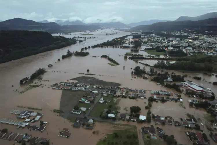 An aerial view shows flooded areas in Encantado city, Rio Grande do Sul, Brazil, on May 1, 2024. At least 10 people have died in floods caused by torrential rains in Brazil's south, authorities said on May 1, as rescuers searched for nearly two dozen individuals reported missing. (Photo by Gustavo Ghisleni / AFP) (Gustavo Ghisleni/AFP)