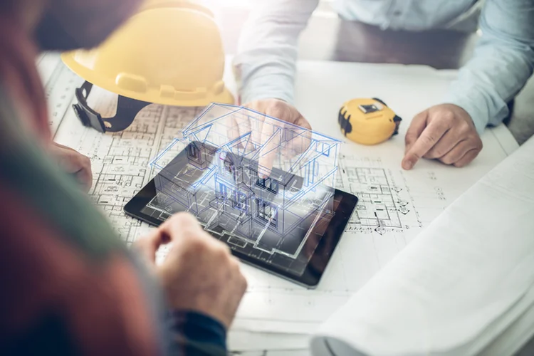 Architect and his client looking at the hologram of a house project over a tablet computer. The client is reviewing his future house layout
Note to inspector: I am the author of the building project (Warchi/Getty Images)