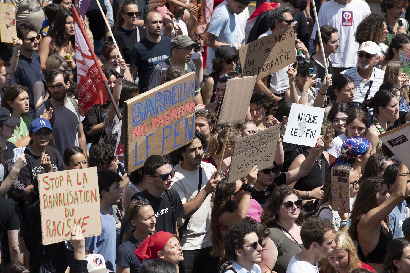 People take part in an anti far-right rally after French president called legislative elections following far-right parties' significant gains in European Parliament elections, in Marseille, southeastern France, on June 15, 2024. Less than a week after the earthquake of the dissolution, opponents of the far-right are called by trade unions, associations and the left-wing coalition of the "Nouveau Front Populaire" to take to the streets across France. (Photo by Jérémy PAOLONI / AFP)