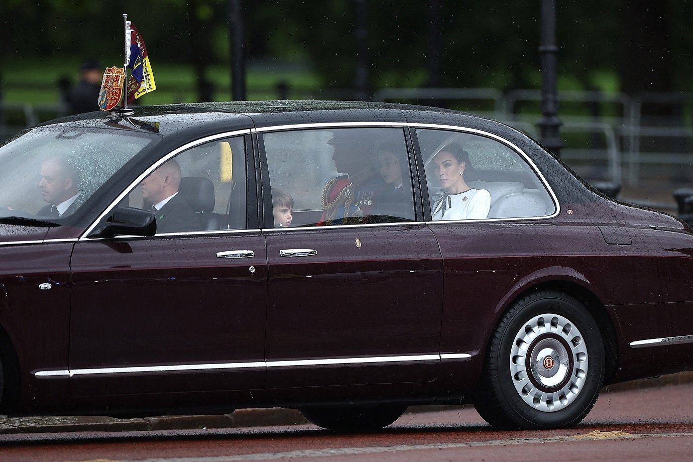 Britain's Catherine, Princess of Wales, (R) arrives with Britain's Prince William, Prince of Wales, (rear 3rdR) and their children Britain's Prince George of Wales (2ndR) and Britain's Prince Louis of Wales (C) to Buckingham Palace before the King's Birthday Parade "Trooping the Colour" in London on June 15, 2024. Catherine, Princess of Wales, is making a tentative return to public life for the first time since being diagnosed with cancer, attending the Trooping the Colour military parade in central London. (Photo by HENRY NICHOLLS / AFP)