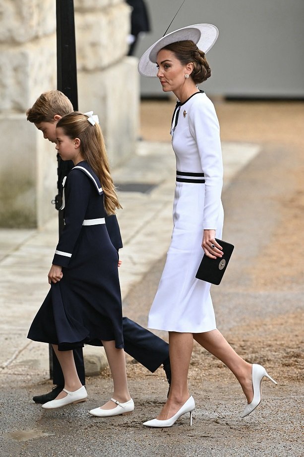 Britain's Catherine, Princess of Wales, arrives with Britain's Princess Charlotte of Wales and Britain's Prince George of Wales to Horse Guards Parade for the King's Birthday Parade "Trooping the Colour" in London on June 15, 2024. Catherine, Princess of Wales, is making a tentative return to public life for the first time since being diagnosed with cancer, attending the Trooping the Colour military parade in central London. (Photo by JUSTIN TALLIS / AFP)