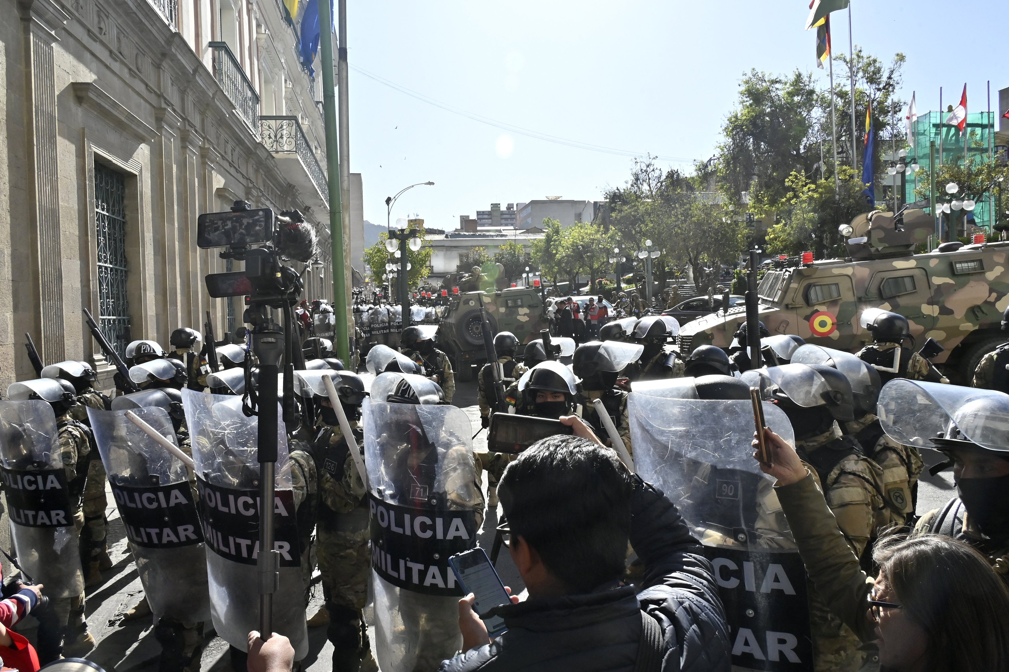Military troops are deployed outside the Quemado Palace at the Plaza de Armas in La Paz on June 26, 2024. Bolivian President Luis Arce on Wednesday denounced the unauthorized gathering of soldiers and tanks outside government buildings in the capital La Paz, saying "democracy must be respected." "We denounce irregular mobilizations by some units of the Bolivian Army," Arce wrote on the X social network. Former president Evo Morales wrote on the same medium that "a coup d'état is brewing." (Photo by AIZAR RALDES / AFP)
