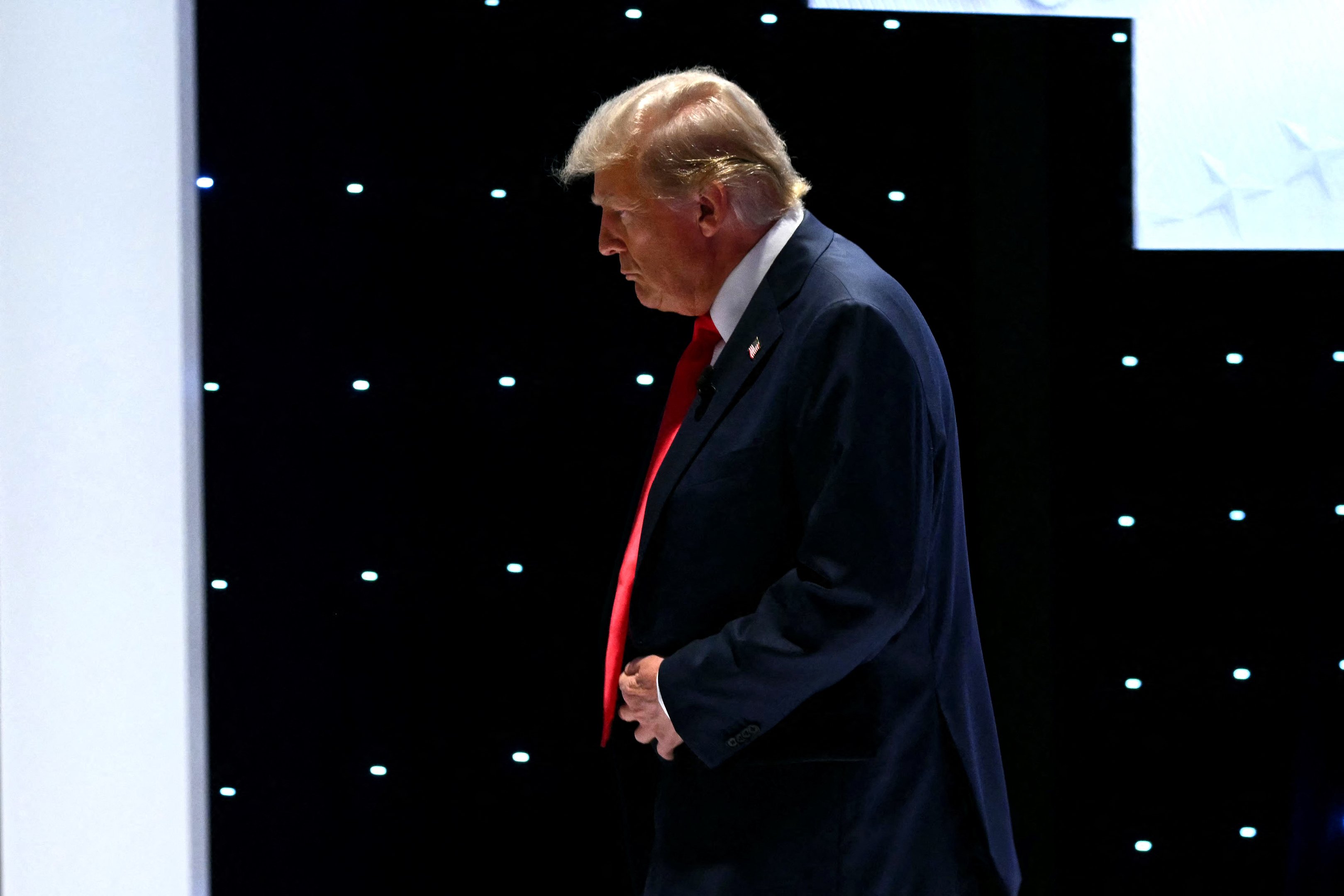 Former US President and Republican presidential candidate Donald Trump leaves the stage during a commercial break as he participates in the first presidential debate of the 2024 elections with US President Joe Biden at CNN's studios in Atlanta, Georgia, on June 27, 2024. (Photo by ANDREW CABALLERO-REYNOLDS / AFP)