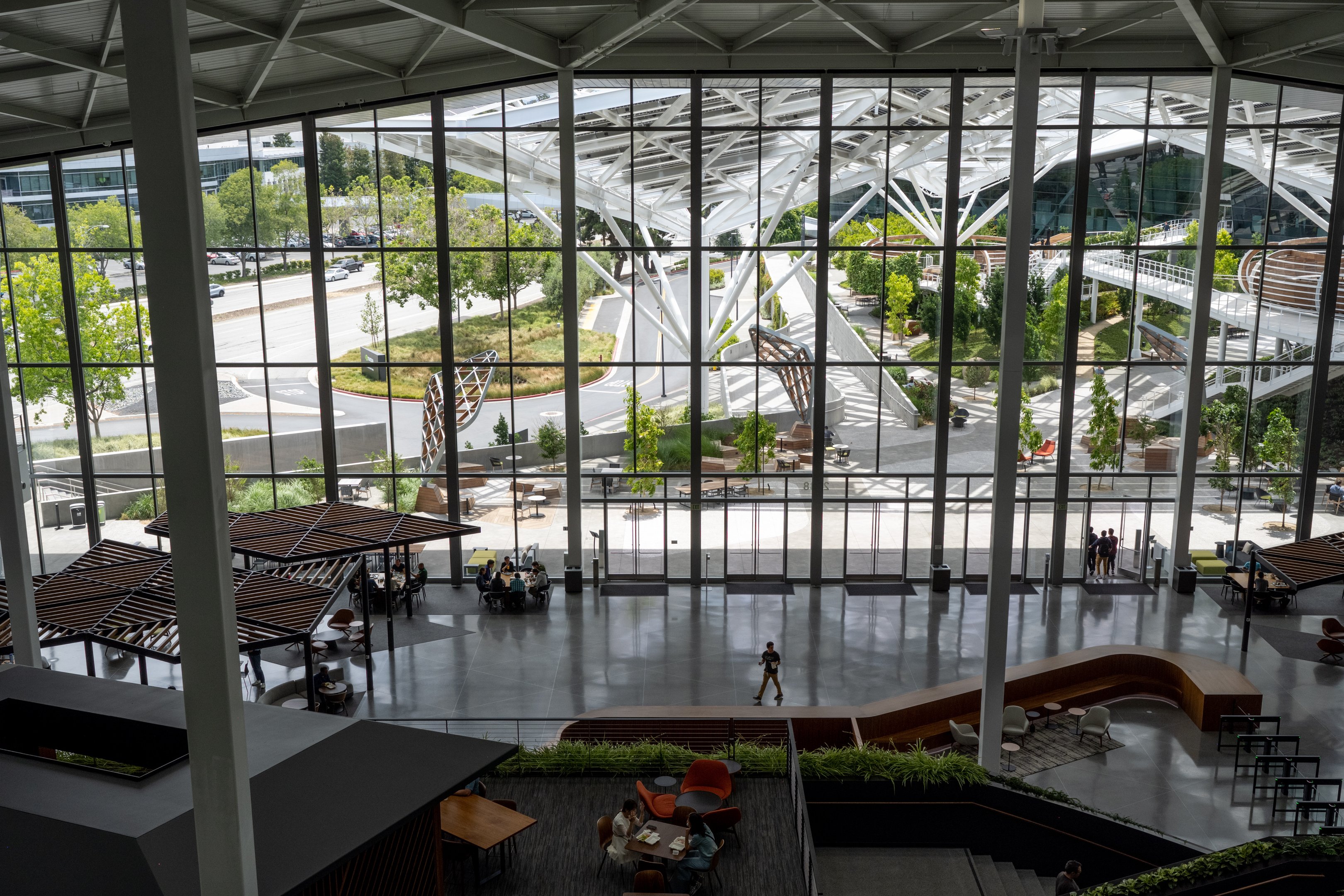 Employees inside the Voyager building at Nvidia headquarters in Santa Clara, California, US, on Monday, June 5, 2023. Nvidia Corp., suddenly at the core of the world's most important technology, owns 80% of the market for a particular kind of chip called a data-center accelerator, and the current wait time for one of its AI processors is eight months. Photographer: Marlena Sloss/Bloomberg via Getty Images