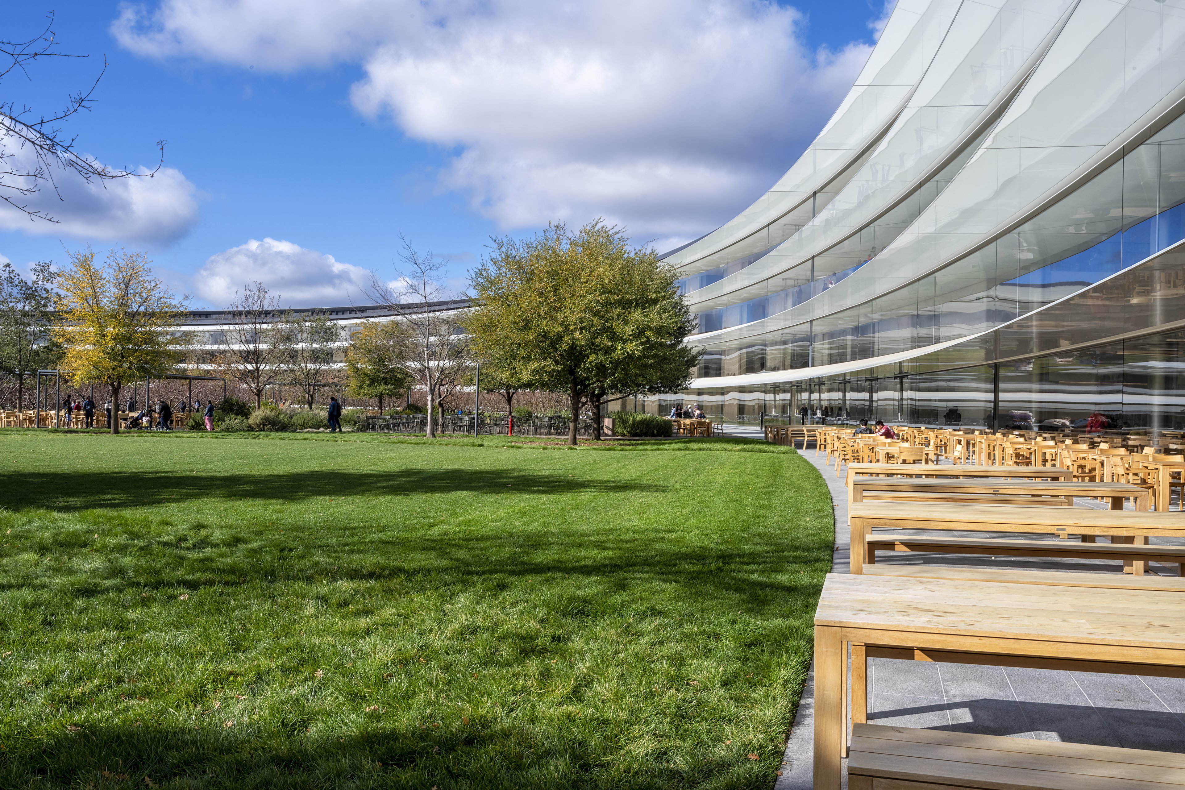 Cupertino CA USA December 14, 2019: Apple headquarters offices building exterior and inner court with outdoor eating area, on a bright cold December day.