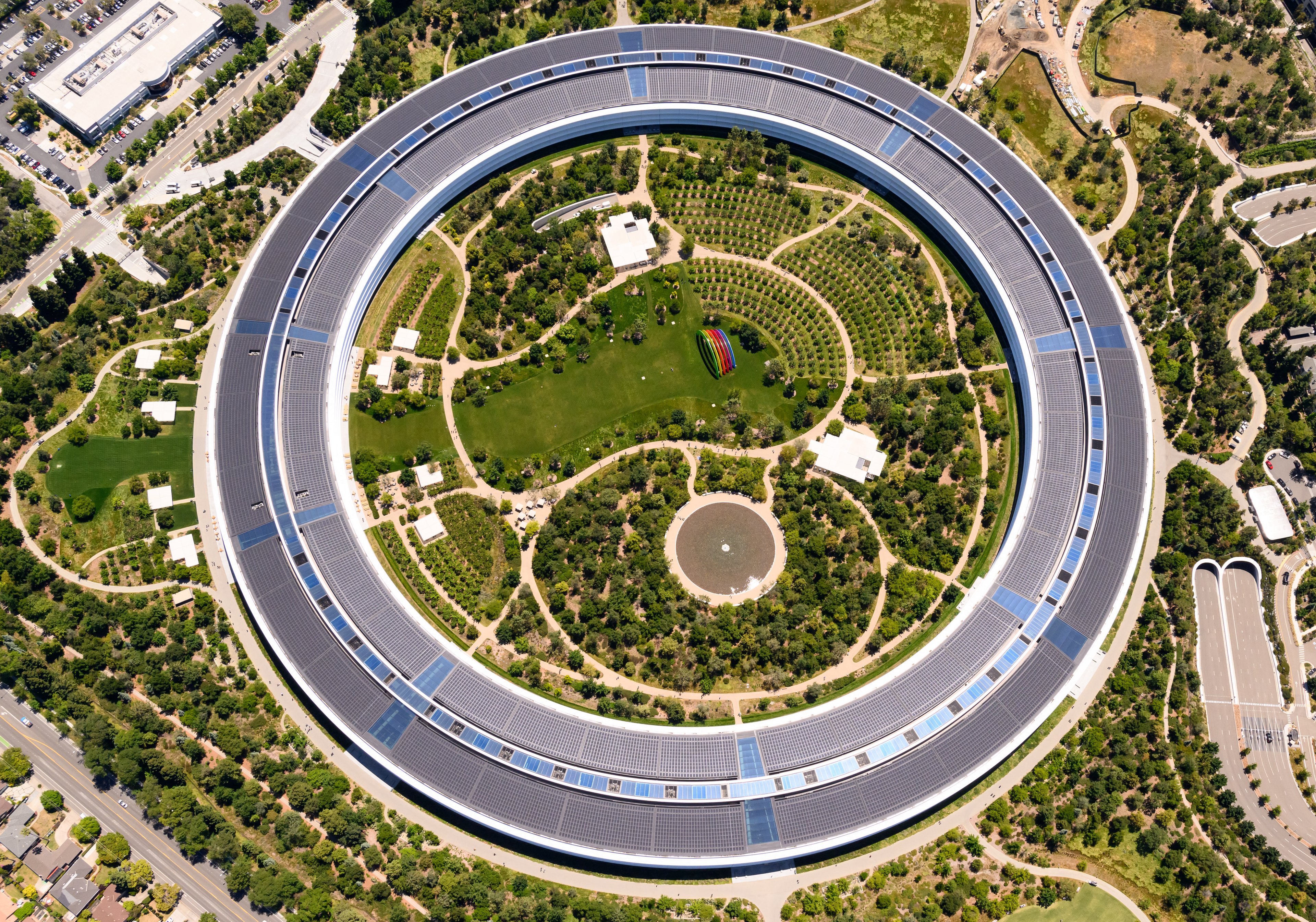 TOPSHOT - Apple Park, Apple's circular HQ office building, is seen in an aerial view over Cupertino, California on May 16, 2024. (Photo by JOSH EDELSON / AFP) (Photo by JOSH EDELSON/AFP via Getty Images)