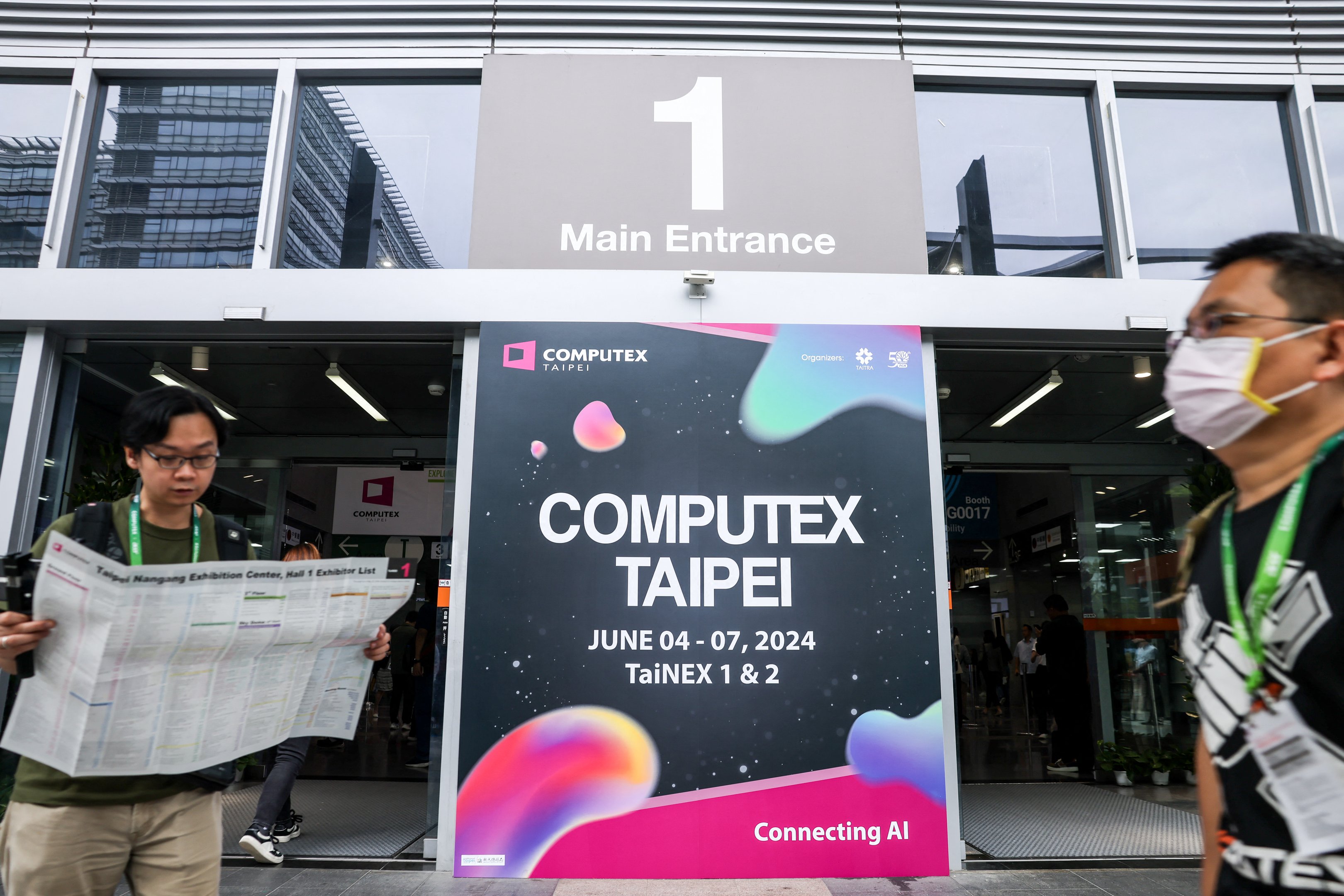 A visitor looks at a map during Computex 2024 in Taipei on June 4, 2024. (Photo by I-Hwa CHENG / AFP) (Photo by I-HWA CHENG/AFP via Getty Images)