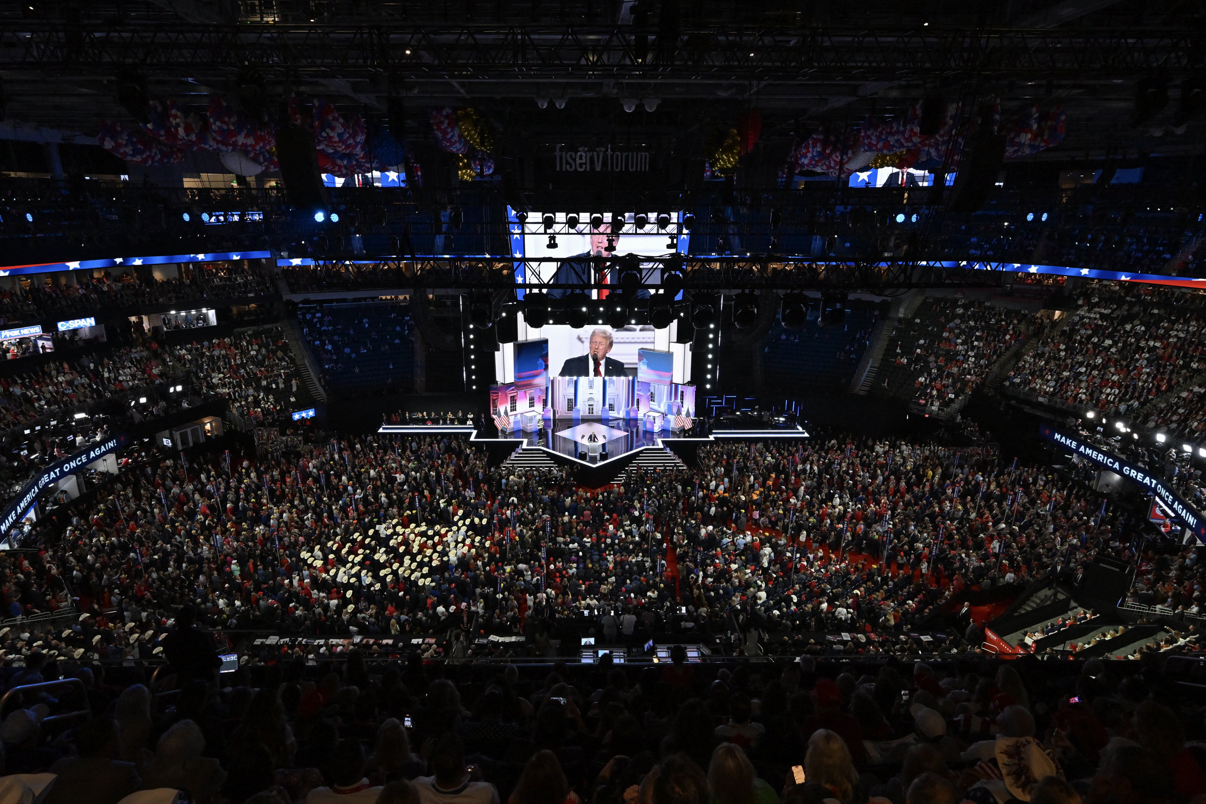 An overall view as former US President and 2024 Republican presidential candidate Donald Trump accepts his party's nomination on the last day of the 2024 Republican National Convention at the Fiserv Forum in Milwaukee, Wisconsin, on July 18, 2024. Days after he survived an assassination attempt Trump won formal nomination as the Republican presidential candidate and picked Ohio US Senator J.D. Vance for running mate. (Photo by Pedro UGARTE / AFP)