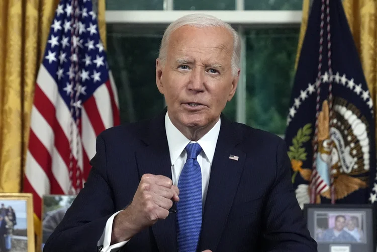 US President Joe Biden speaks during an address to the nation about his decision to not seek reelection, in the Oval Office at the White House in Washington, DC, on July 24, 2024. US President Joe Biden will give an Oval Office speech July 24, 2024 to explain his historic decision to drop out of the 2024 election and pass the torch to Kamala Harris, with the White House denying any cover up over his health. In his first address to the nation since quitting the race, the 81-year-old is expected to burnish his legacy and deny he will spend six months as a lame duck president. (Photo by Evan Vucci / POOL / AFP) (Evan Vucci / POOL / AFP/AFP)