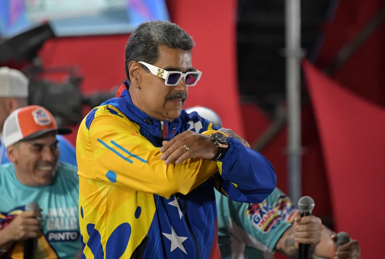 Venezuelan President and presidential candidate Nicolas Maduro reacts following the presidential election results in Caracas on July 29, 2024. Venezuela's President Nicolas Maduro won reelection with 51.2 percent of votes cast Sunday, the electoral council announced, after a campaign tainted by claims of opposition intimidation and fears of fraud. (Photo by Yuri CORTEZ / AFP)