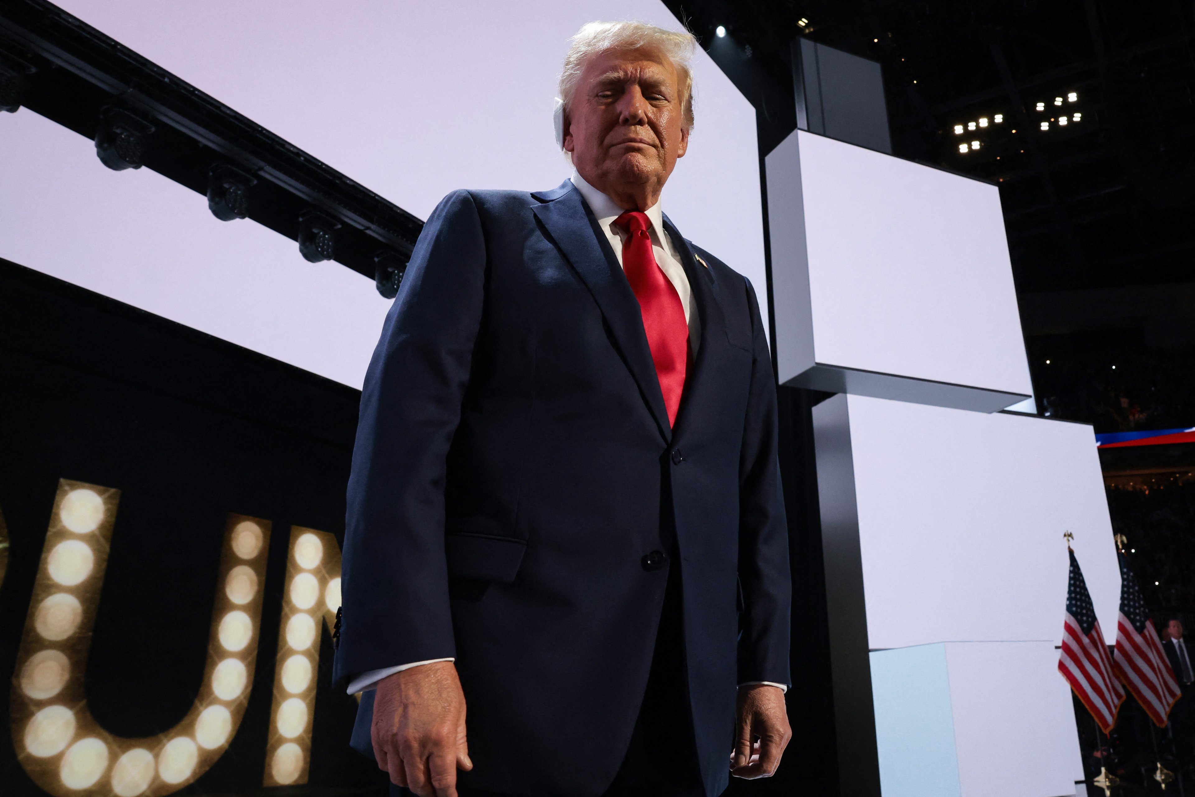 MILWAUKEE, WISCONSIN - JULY 18: Republican presidential nominee, former U.S. President Donald Trump walks on stage on the fourth day of the Republican National Convention at the Fiserv Forum on July 18, 2024 in Milwaukee, Wisconsin. Delegates, politicians, and the Republican faithful are in Milwaukee for the annual convention, concluding with former President Donald Trump accepting his party's presidential nomination. The RNC takes place from July 15-18.   Win McNamee/Getty Images/AFP (Photo by WIN MCNAMEE / GETTY IMAGES NORTH AMERICA / Getty Images via AFP)