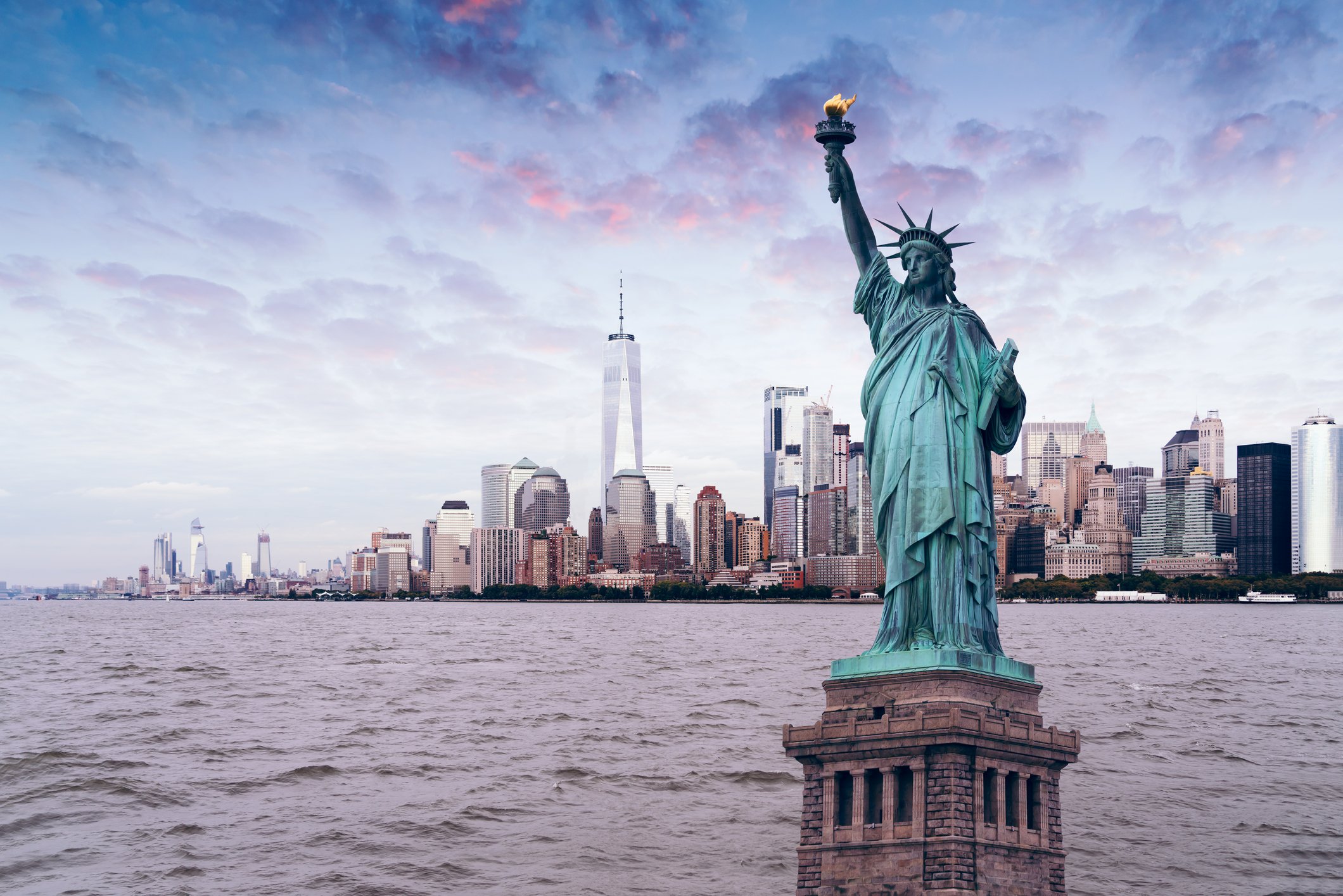 The statue of Liberty with World Trade Center background, Landmarks of New York City