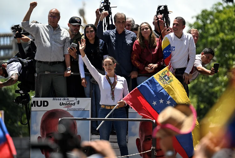 Venezuelan opposition leader Maria Corina Machado waves from atop a truck during a demonstration to protest over the presidential election results, in Caracas on August 3, 2024. Venezuela braced for fresh protests after President Nicolas Maduro's disputed election victory was ratified on the eve -- and a growing number of nations recognized his opposition rival as the true winner (JUAN BARRETO/AFP)