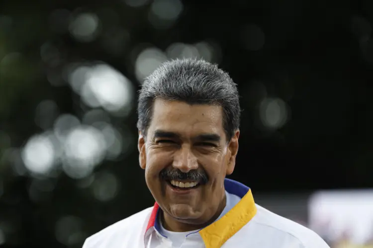 Venezuelan President Nicolas Maduro smiles during a rally in Caracas on August 3, 2024. Venezuela braced for fresh protests after President Nicolas Maduro's disputed election victory was ratified on the eve -- and a growing number of nations recognized his opposition rival as the true winner. (Photo by Pedro Rances Mattey / AFP) (Pedro Rances Mattey/AFP)