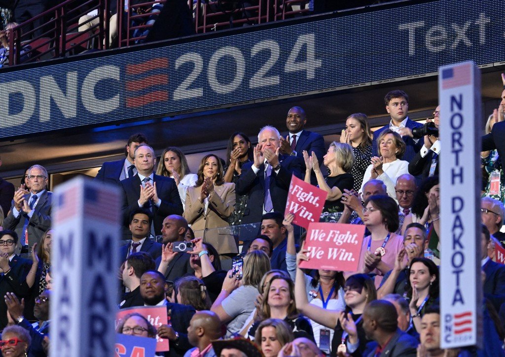 US Second Gentleman Douglas Emhoff, US Vice President and 2024 Democratic presidential candidate Kamala Harris, Minnesota Governor and 2024 Democratic vice presidential candidate Tim Walz and his wife walz Gwen Walz attend the first day of the Democratic National Convention (DNC) at the United Center in Chicago, Illinois, on August 19, 2024. Vice President Kamala Harris will formally accept the partys nomination for president at the DNC which runs from August 19-22 in Chicago. (Photo by Robyn Beck / AFP)